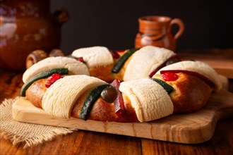 Three Kings Bread also called Rosca de Reyes, Roscon, Epiphany Cake, traditionally served with hot chocolate in a clay Jarrito. Mexican tradition on J