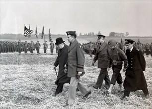 OPERATION OVERLORD PREPARATIONS   25 March 1944. From left: British Prime Minister Winston Churchill, US Generals Maxwell D. Taylor,  Dwight D. Eisenhower, Don F.  Pratt and  British Admiral Bertram R...