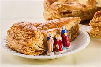Epiphany cake on wooden table. Galette des rois traditional Epiphany cake in France.