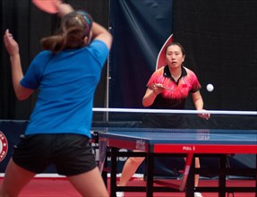 Jun Gao,  who won a silver medal for China at the 1992 Barcelona Olympic Games, returns a serve at the U.S. Olympic table tennis trials in Cary, N.C., Feb. 12, 2012. Gao and three other American women...