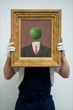 London, UK. 7th June 2013. A Sotheby's employee named Pietro holds “L’idee” by Rene Magritte (Est. 1.8 – 2.5million) during the preview of this summer auction at Sotheby's estimated at £100 million. C...