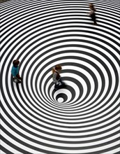 Three children play on the walkable disc 'Spazio ad Attivazione Cinetica' by the Italian artist Marina Appolonio at the entrance of the Schirn exhibition hall in Frankfurt, Germany, 16 February 2007. ...