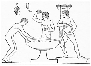 This red-figured vase painting shows ancient Greek youths washing after athletic practice. In the center is a large stone basin.