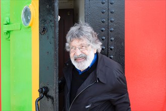 Liverpool, UK, 12th May 2014. Artist Carlos Cruz-Diez visits a freshly painted dazzle ship in Liverpool. In collaboration with the Liverpool Biennial he designed the paint scheme for the ship Edmund G...
