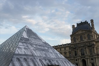 Louvre museum pyramid covered with thousands of paper sheets to make it disappear with an optical illusion.