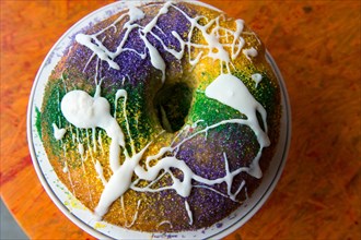 New Orleans king cake up close on a table.