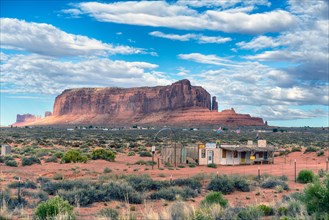 Abandoned tourist shop, note the large 'dream catcher' with Navajo settlement in the background. Arizona-Utah border, USA