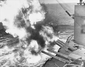 Forward 14/45 guns of USS Nevada (BB-36) fire on positions ashore, during the landings on Utah Beach, 6 June 1944. D-Day