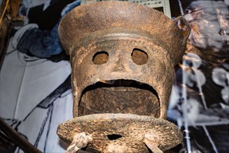 Pareidolia, face in old Chinese metal cookware object