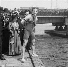 Houdini jumps from Harvard Bridge, 1908, Houdini standing by the side of the Charles River wearing chains and handcuffs.
Harry Houdini (1874 – 1926) Austro-Hungarian-born American Escape Artist, illus...