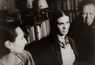 The Mexican artist - painter Frida Kahlo with husband artist Diego Rivera at her side on the right.