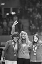 Winter Olympics in Grenoble  The honorary stage for the medalists in skating for women over 1000 meters. From left to right Lyudmila Titova (USSR, second), Carry Geijssen (Netherlands, first) and Dian...