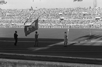 Olympic Games in Rome. Opening. Entry of the athletes in the Olympic Stadium. [The delegation of Haiti consists of one athlete, weightlifter Philomene Lagurre and delegation head Pierre Plaisimond] An...