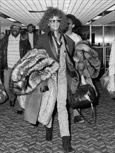 American singer and actress Whitney Houston arriving in London in October 1986.