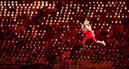 London England, August 29 2012: A disabled athlete, suspended by invisible wires, appears to run through the air above the stadium floor during the Opening Ceremonies of the 2012 London Paralympic Gam...