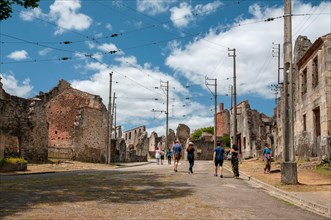 Main street of Oradour-sur-Glane with ruins of the village where the inhabitants were murdered by the Nazis on 10th of June 1944, Haute-Vienne (87), N