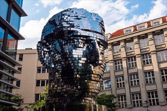 Prague, Czech Republc - July 11 2020: Turning Head of Franz Kafka in Czech Hlava Franze Kafky Statue by Davd Cerny