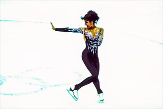 Debi Thomas (USA) competing in the Ladies Figure Skating Short Program at the 1988 Olympic Winter Games.