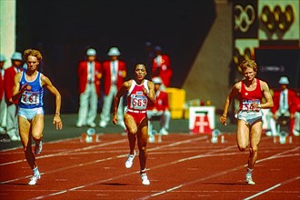Florence Griffith Joyner (USA) #554  competes in the Women's 100m Semi-Final at the 1988 Olympic Summer Games.