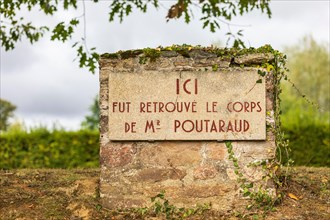 Europe, France, Haute-Vienne, Oradour-sur-Glane. Sign saying 'Here was found the body of Mr. Poutaraud' in the martyr village of Oradour-sur-Glane. (E