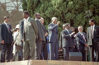 Nelson Mandela greets the crowd with a raised fist at his inauguration at the Union Buildings,10 May 1994, Pretoria, South Africa.