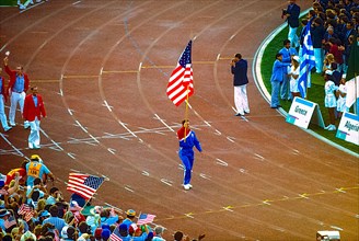 Ed Burke Team USA flag bearer marches in the opening ceremonies at the 1984 Oympic Summer Games.