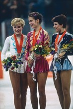 L-R Rosalynn Sumners (USA),Katarina Witt (GDR), Kira Ivanova (URS) Figure Skating Ladies' singles medalist at the 1984 Olympic Winter Games.