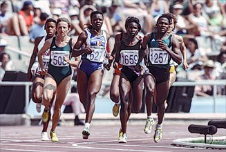 Maria Mutola (MOZ) #1257, Viviane Dorsile (FRA) #627, Lyubov Gurina (EUN) #508 in the first round heat of the Women's 800 meters at the 1992 Olympic Summer Games.