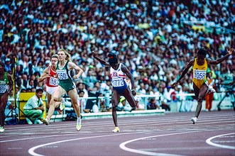 Gwen Torrence (USA) #1772, Irina Privalova (EUN) #550, Merlene Ottey (JAM) #1058 competing in the semi-finals of the Women's 100 meters at the 1992 Olympic Summer Games.