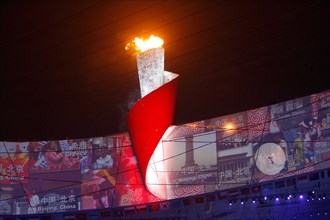 210204 -- BEIJING, Feb. 4, 2021 -- Chinese gymnastics champion Li Ning lights up the cauldron of the Beijing Olympic Games during the opening ceremony of the Beijing Olympics held in the National Stad...