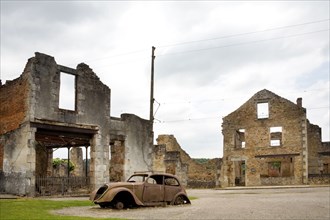the French village Oradour-sur-Glane. It has been preserved In a Ruined State, buildings and car seen here destroyed by fire.