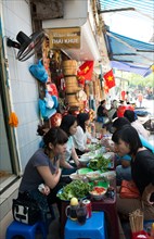 Local Vietnamese enjoying Bun Cha for lunch.