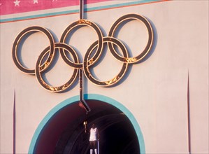 Rafer Johnson brings Olympic torch to light flame during opening ceremonies at 1984 Olympic Games in Los Angeles.