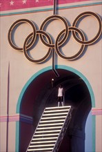 Rafer Johnson brings Olympic torch to light flame during opening ceremonies at 1984 Olympic Games in Los Angeles.