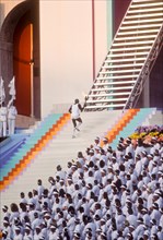 Rafer Johnson brings Olympic torch to light flame during opening ceremonies at 1984 Olympic Games in Los Angeles.