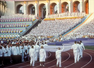 Olympic medalists carry and escort the Olympic flag in the Opening Ceremonies of the 1984 Olympic Games in Los Angeles.