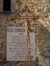 Oradour sur Glane war memorial village ruins, Haute Vienne, France with memorial sign on the church.