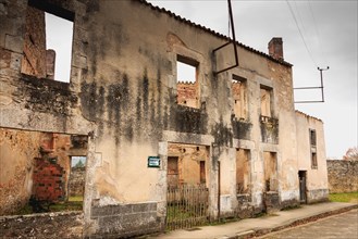 ORADOUR SUR GLANE, FRANCE - December 03, 2017 : ruined house destroyed by fire following the massacre of the entire population by the German army on J
