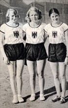 Photograph of (Left to right) Ottilie ("Tilly") Fleischer (1911 - 2005), Ellen Braumuller (1910 - 1991) & Maria "Marie" Dollinger-Hendrix (1910 - 1994). These women competed for Germany during the 193...
