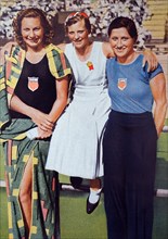 Photograph (from left to right) of Helene Emma Madison (1913 - 1970) from the USA with Willemijntje den Ouden (1918 - 1997) from the Netherlands and Eleanor Saville (1909 - 1998) during the 1932 Olymp...