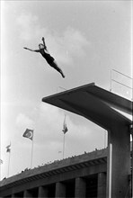 Summer Olympics 1936 - Germany, Third Reich - Olympic Games, Summer Olympics 1936 in Berlin. Men swimming competition at the swimming stadium  - platform  diver - view of the jump. Image date August 1...