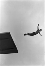 Summer Olympics 1936 - Germany, Third Reich - Olympic Games, Summer Olympics 1936 in Berlin. Men swimming competition at the swimming stadium  - platform diver - view of the jump. Image date August 19...