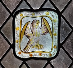 A circa 15th century stained glass panel depicting a falcon, Church of St Lawrence, Barton on the Heath, Warwickshire