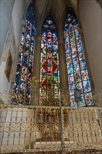 Beautiful stained glass windows and side chapel inside Augsburger Dom (Cathedral of Augsburg), Augsburg, Bavaria, Germany.