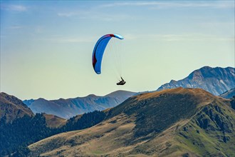 Paragliding, extreme sport, flying over the Pyrenees on the French side. Luchon Superbagnères Ski Resort, France