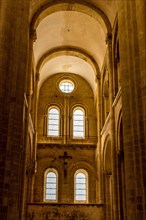 Stained glass window by Pierre Soulages, Sainte Foy abbey church in the ancient village of Conques on Saint James Way,Aveyron, Occitanie, France