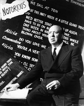 ALFRED HITCHCOCK Portrait on set during filming of NOTORIOUS ! 1946 director ALFRED HITCHCOCK writer BEN HECHT gowns EDITH HEAD Vanguard Films / RKO Radio Pictures