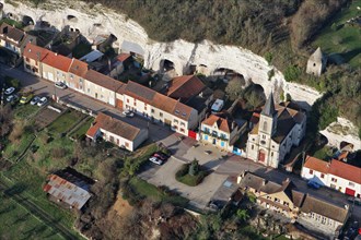 Aerial view of Mousseaux-sur-Seine village, the church and white cliffs troglodythes in the Yvelines department (78270), Ile-de-France region, France