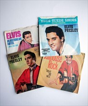 Collection of Elvis Presley singles on vinyl, with picture covers