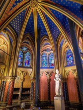 Statue of Saint Louis in Sainte Chapelle: Extravagant arches gilded with gold in a deep blue ceiling frame a statue of Statue of Saint Louis  Louis IX at the front of the lower floor of the famous cha...